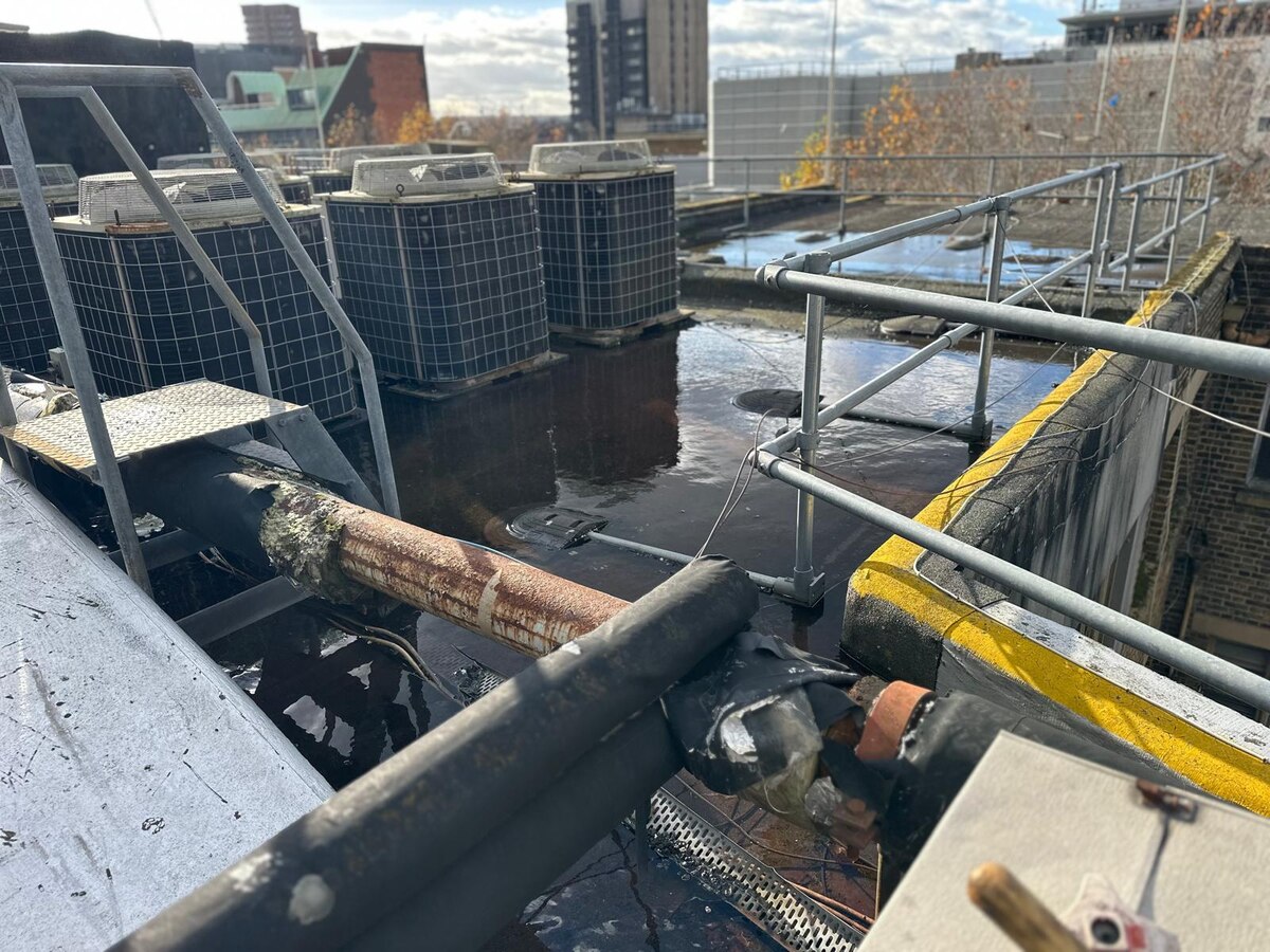 Commercial flat roof drainage flooding