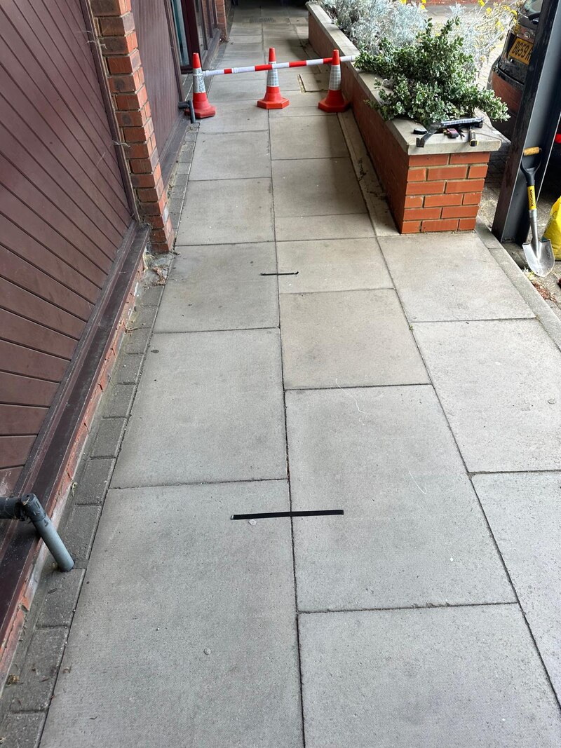 Drain location survey markings on pavement